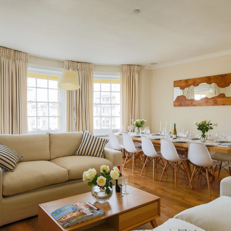 Living room and dining area in the sea view penthouse maisonette